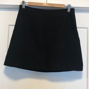 Black Babaton mini skirt with side zip closure